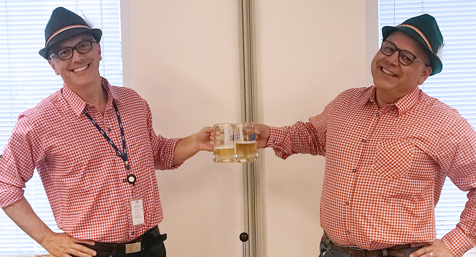 Feeding America - body1 Josh Jackson and Mark Escobar celebrate Oktoberfest, one of the larger fundraisers organized by SAIC employees.