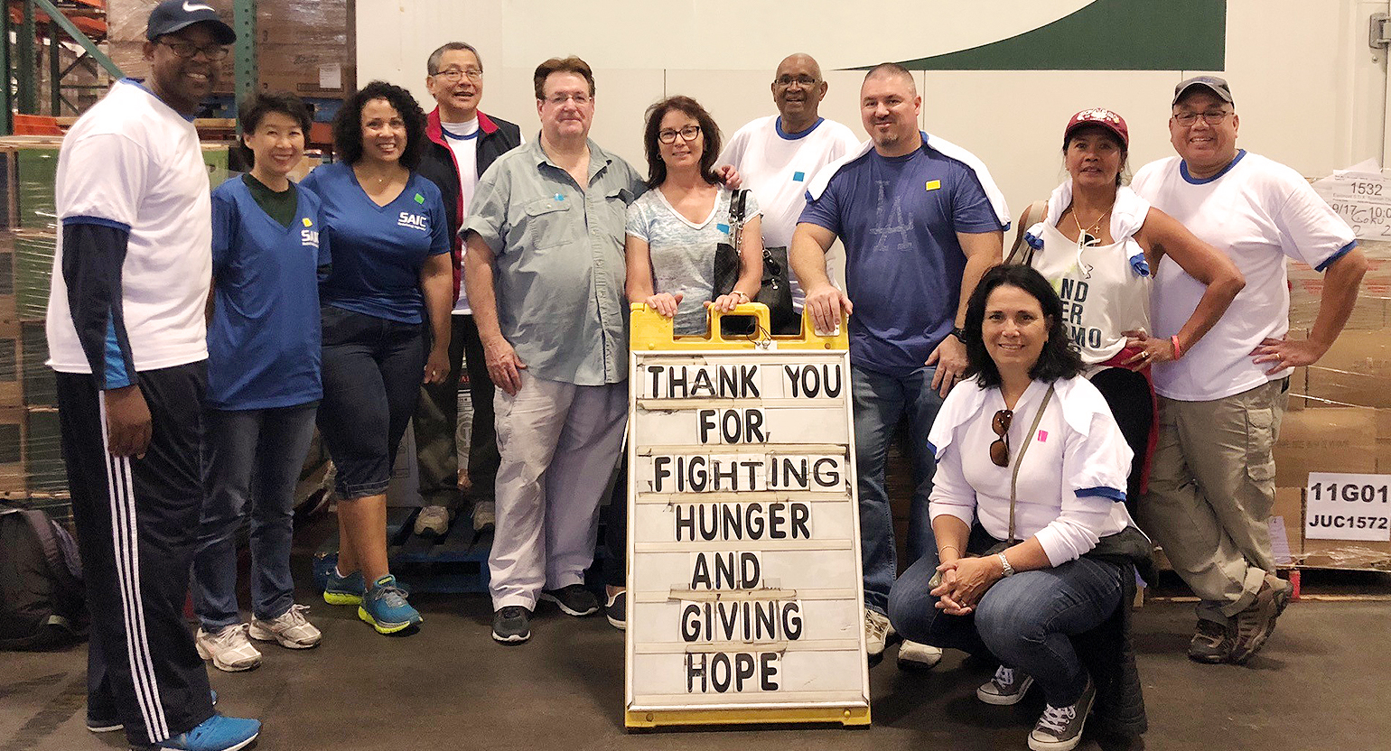 Feeding America - body2 Employees volunteer at the Los Angeles regional food bank.