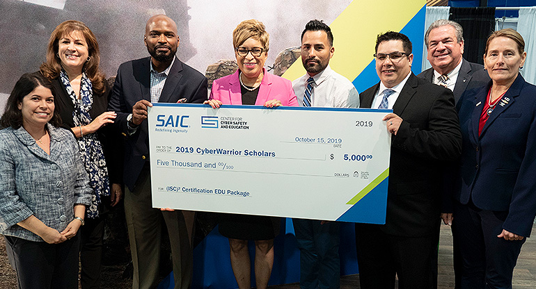 SAIC awards $5,000 scholarships each to four of the 2019 CyberWarrior Scholarship recipients, Peter Alvarado-Ruiz, Marylyn Harris, Jeremy Rodriguez, and Jermaine White. 2019 SAIC CyberWarrior Scholarship winners