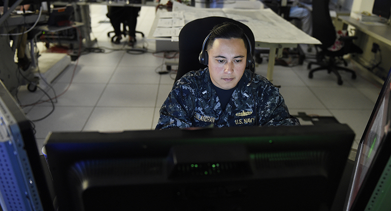 feature_fleet_synthetic_training_body2 A service member participating in fleet synthetic training remotely.
