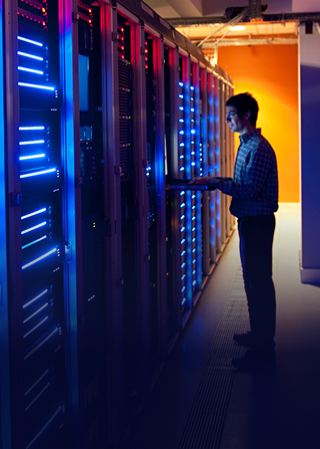 Man looking at server racks